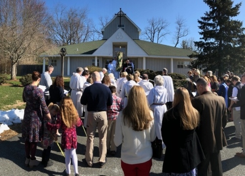 Congregation standing outside of St. Francis Church on Palm Sunday