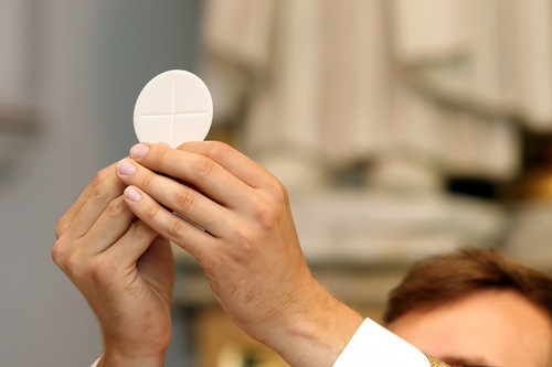 st francis episcopal church staff carrying a wafer for service